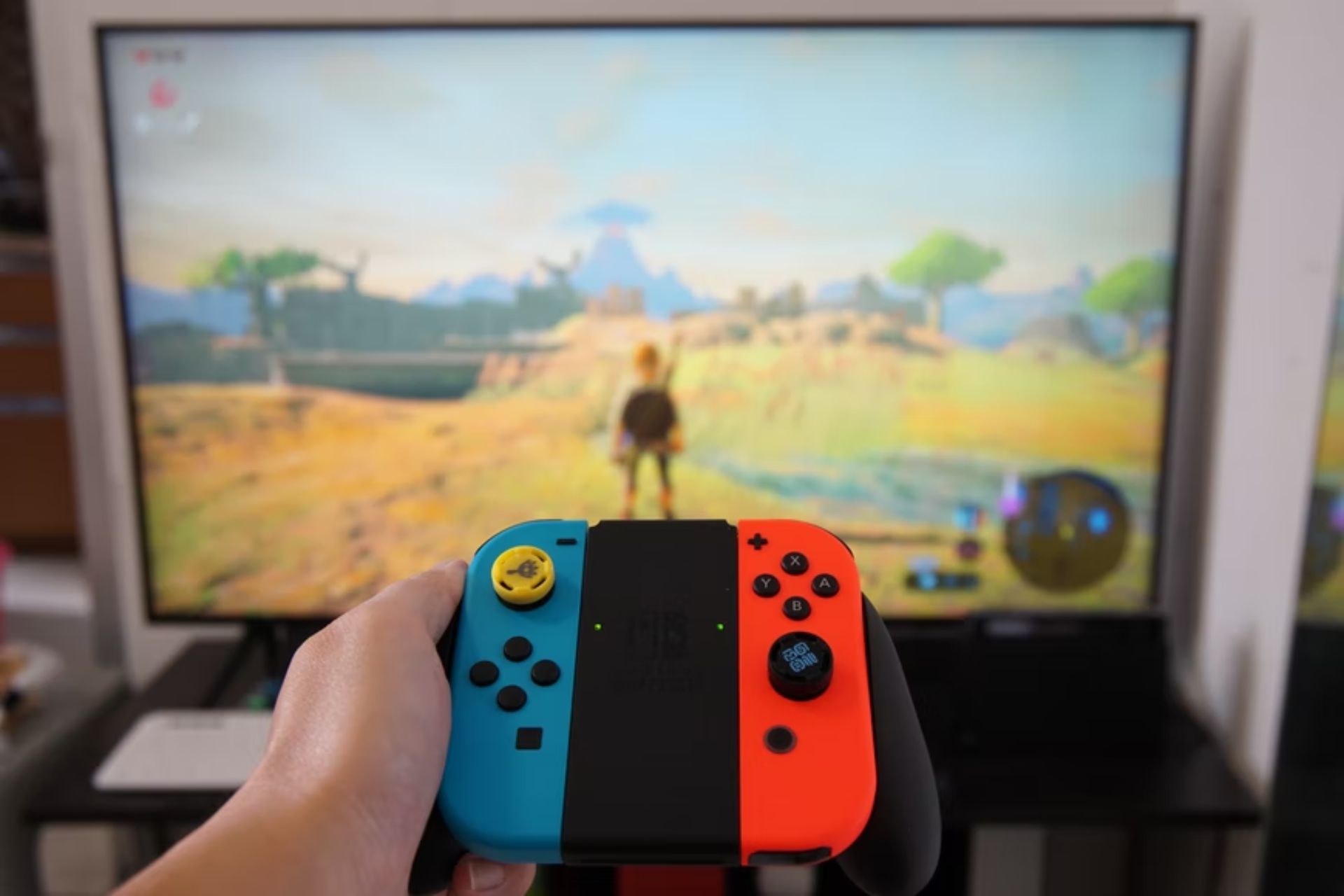 Nintendo Switch in front of TV screen.