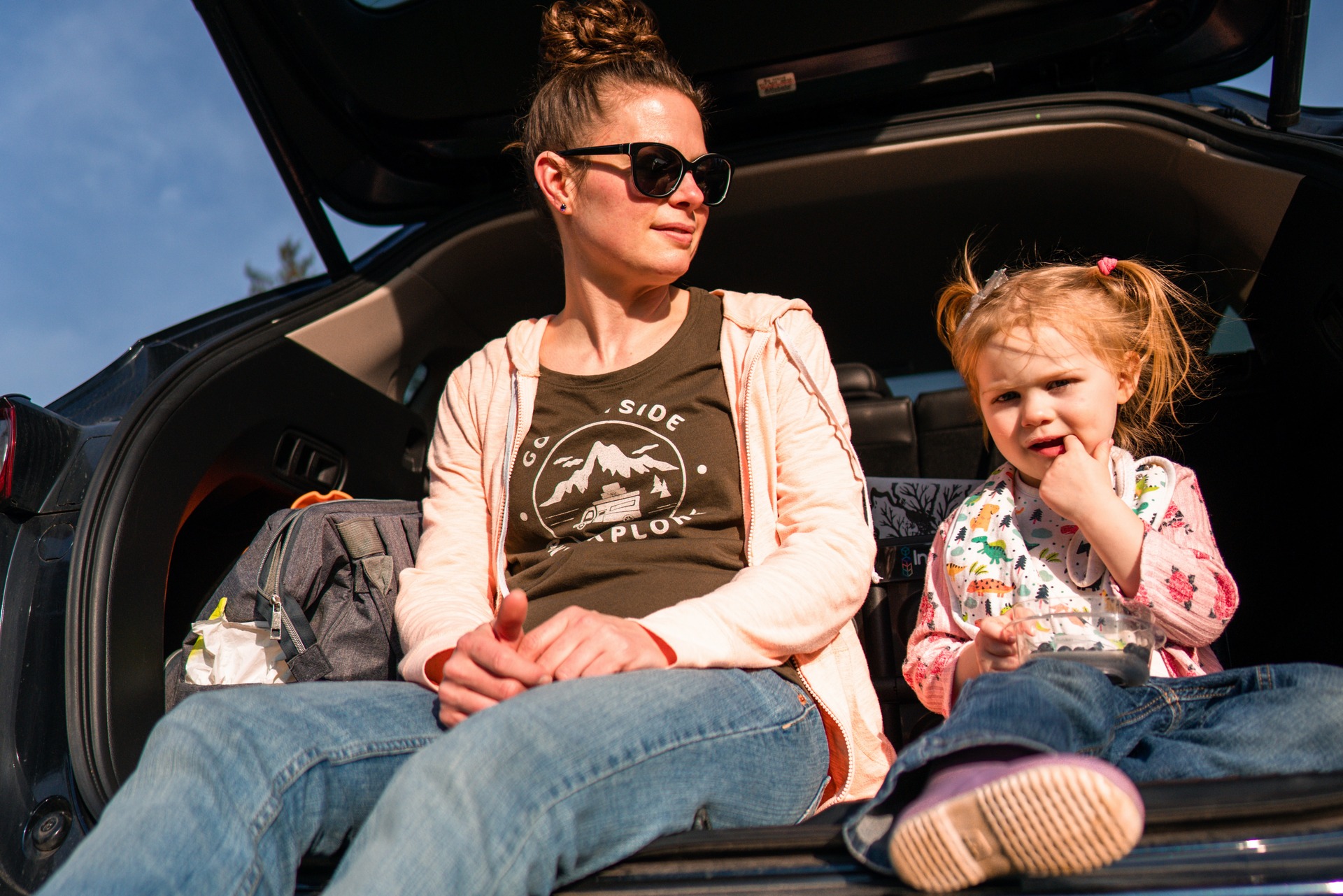 woman and a child in a car