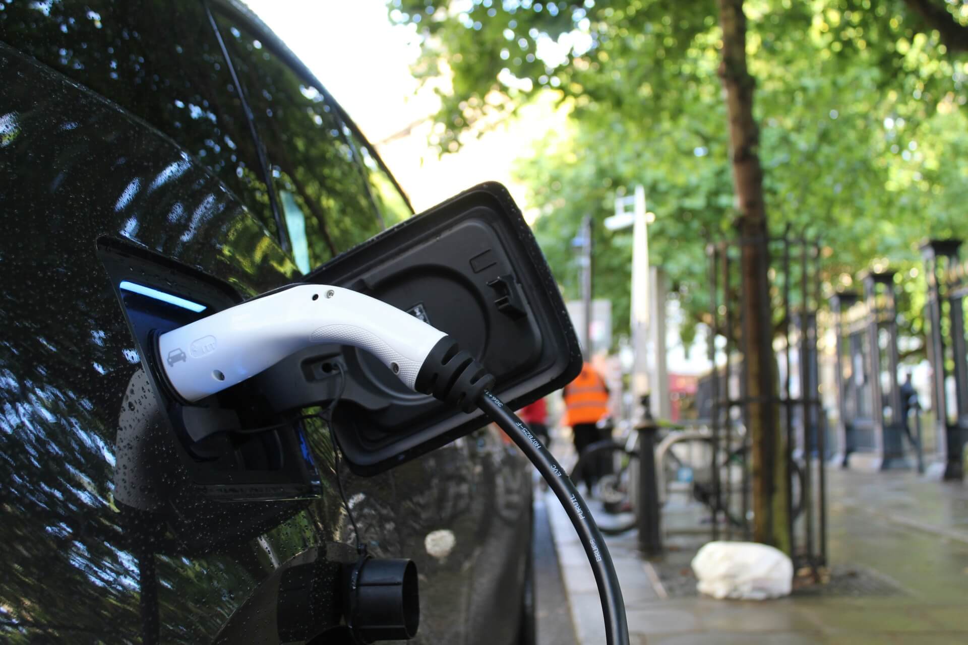 Electric vehicle plugged into a public charger