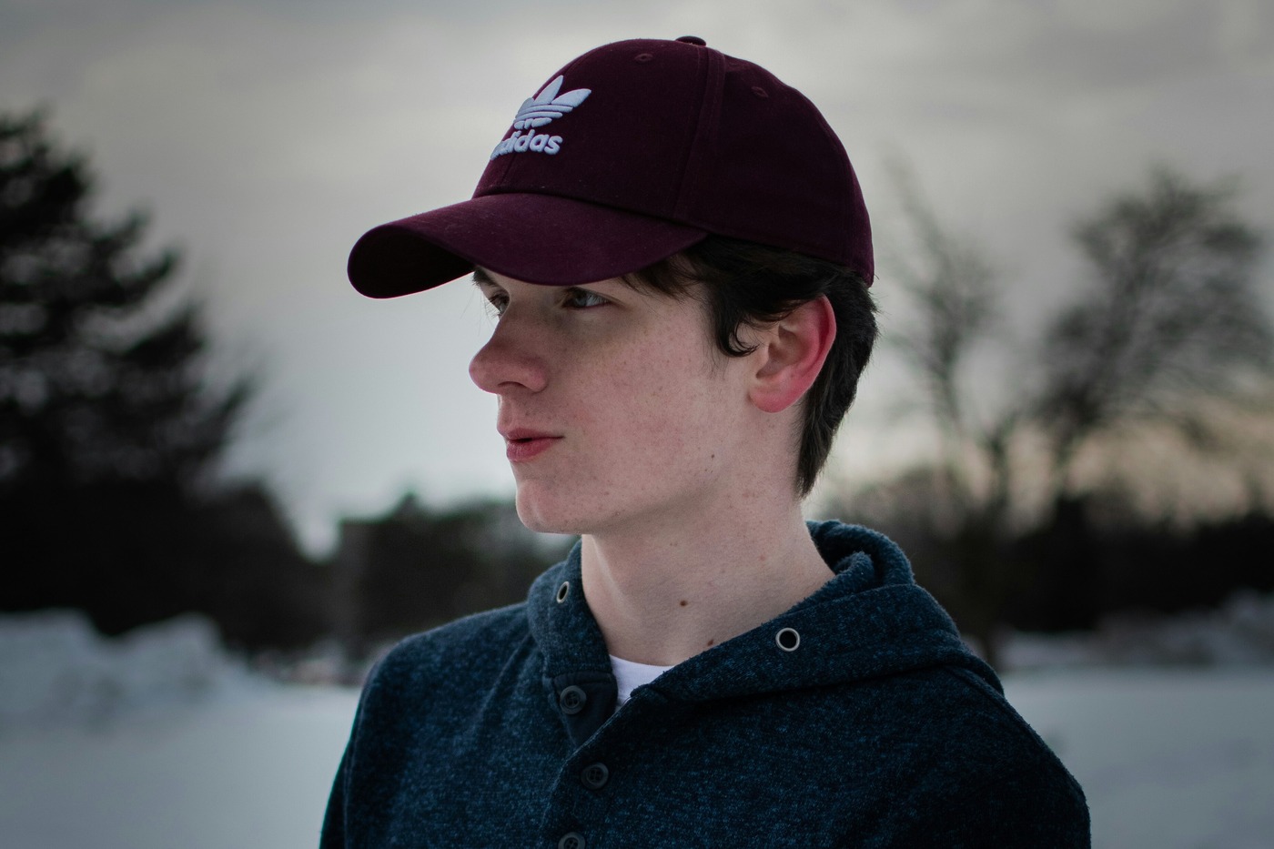 A cold young man in thin outerwear