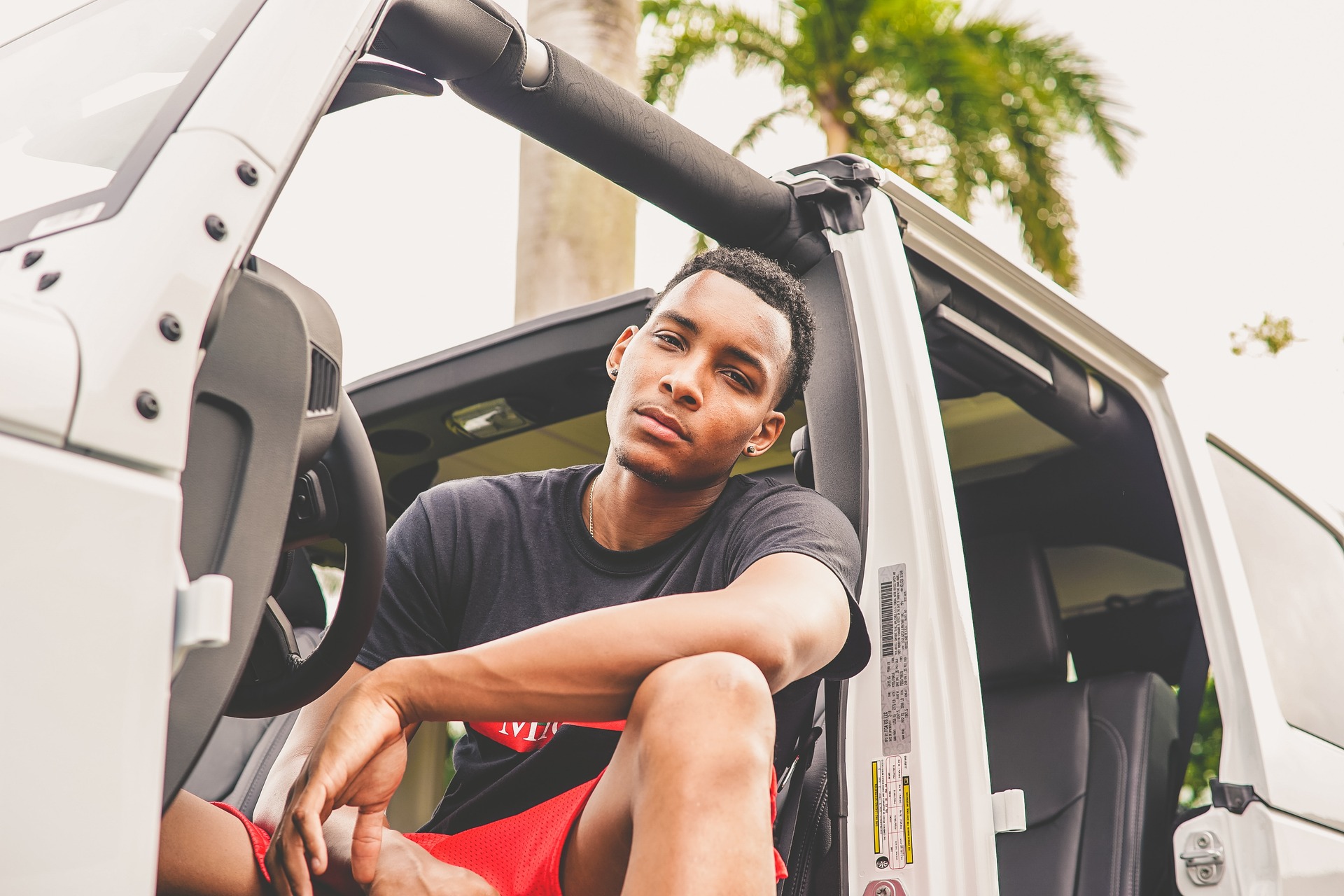 Young man behind the wheel of a Jeep