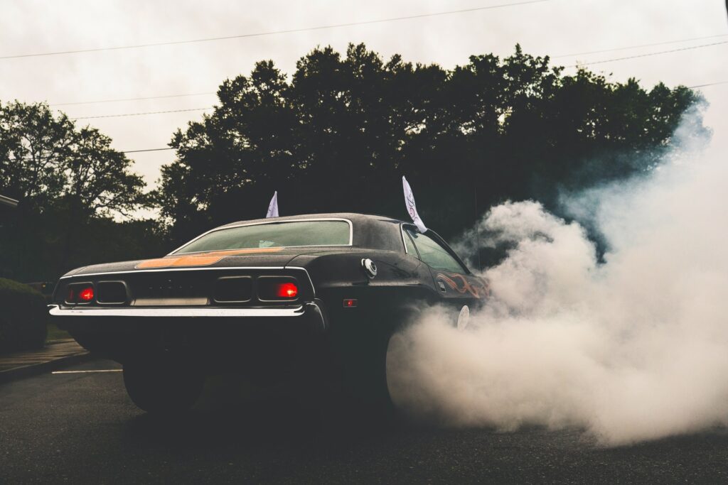 A smoking black coupe