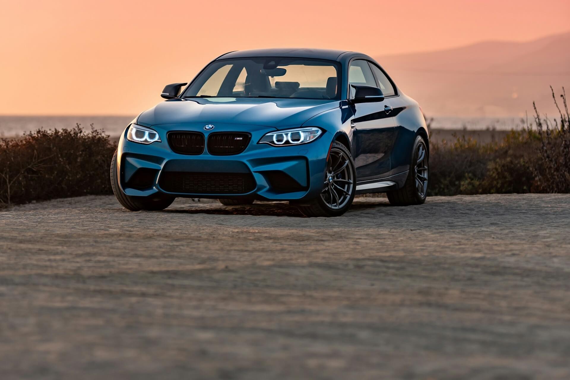 Blue BMW with an orange background