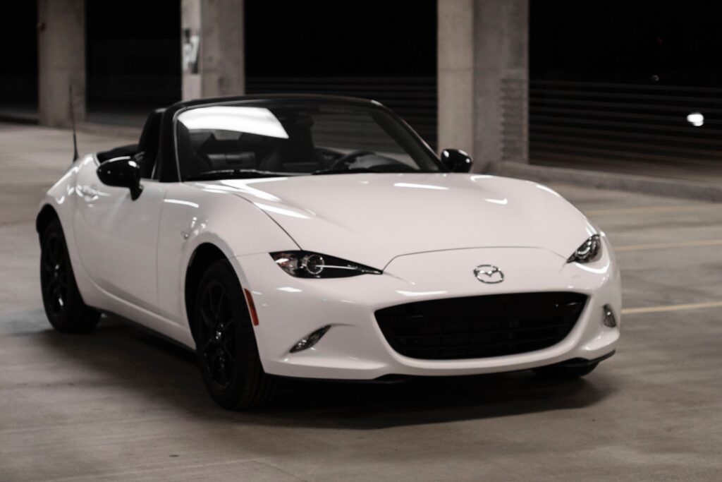 white Mazda Miata in a garage