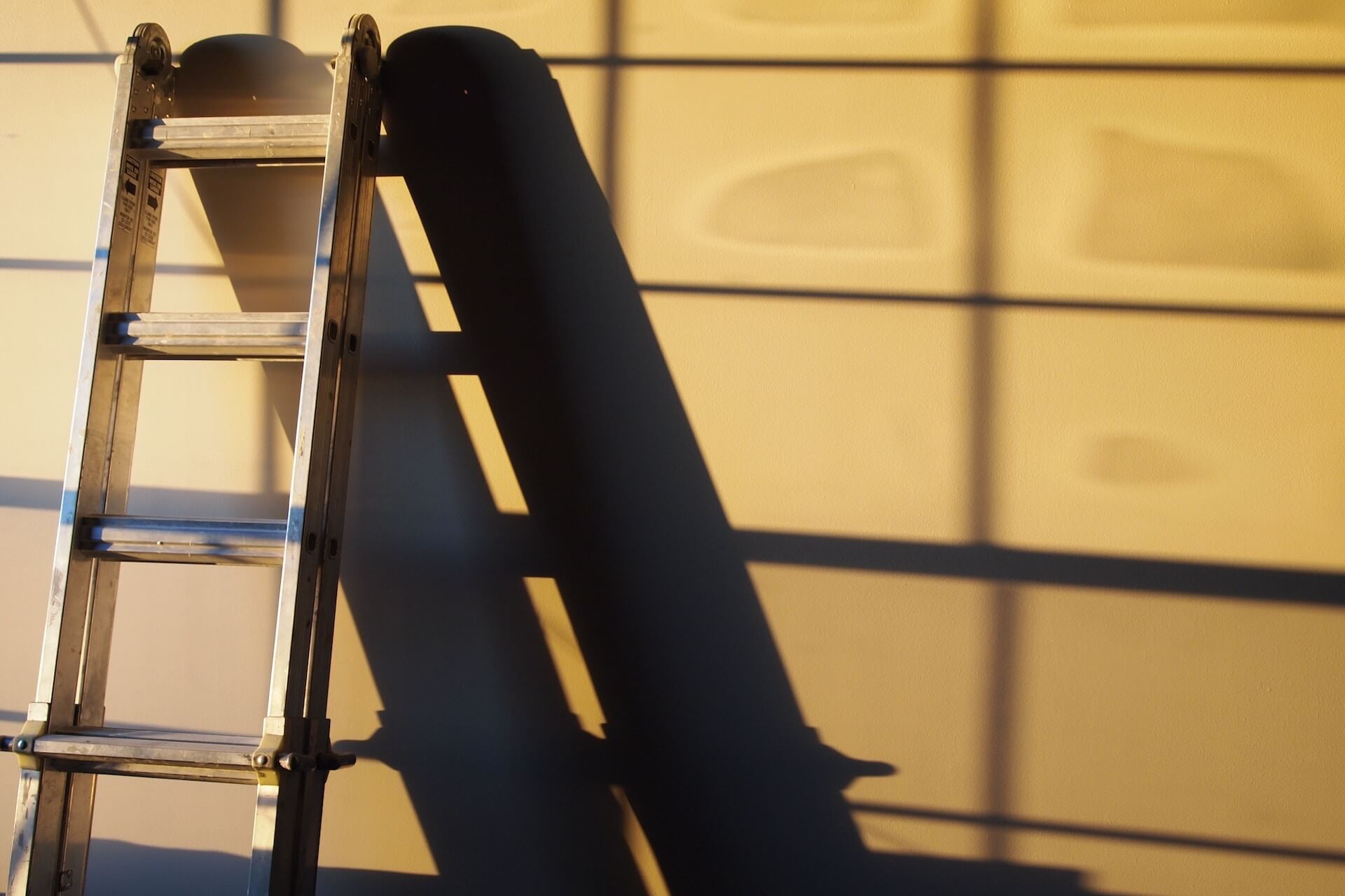 Ladder leaning against a wall