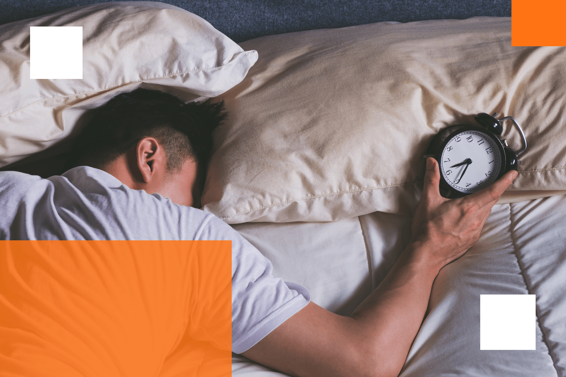 Man holding an alarm clock.