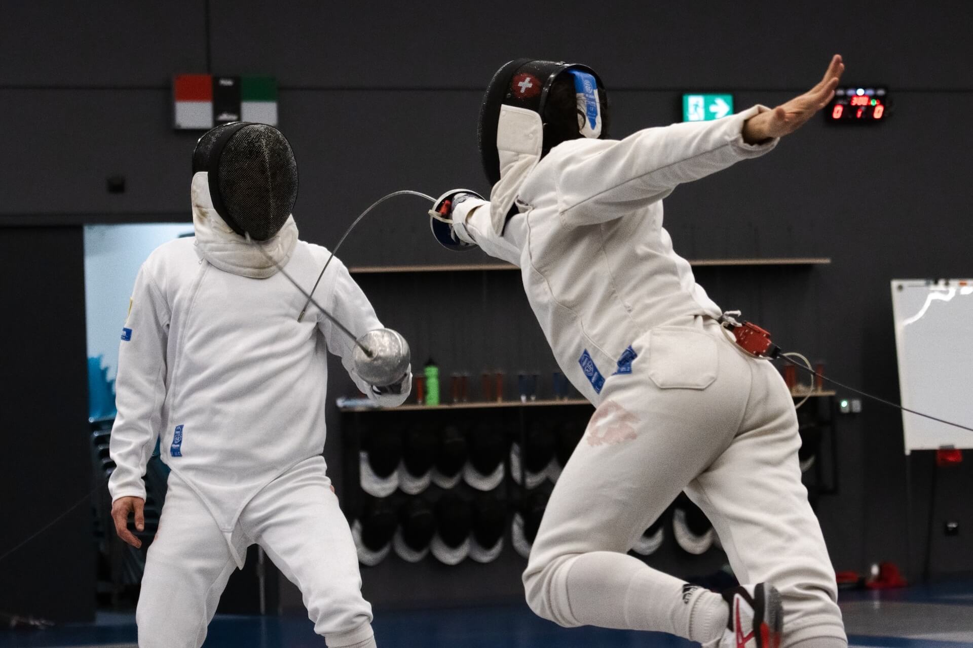 Two people fencing