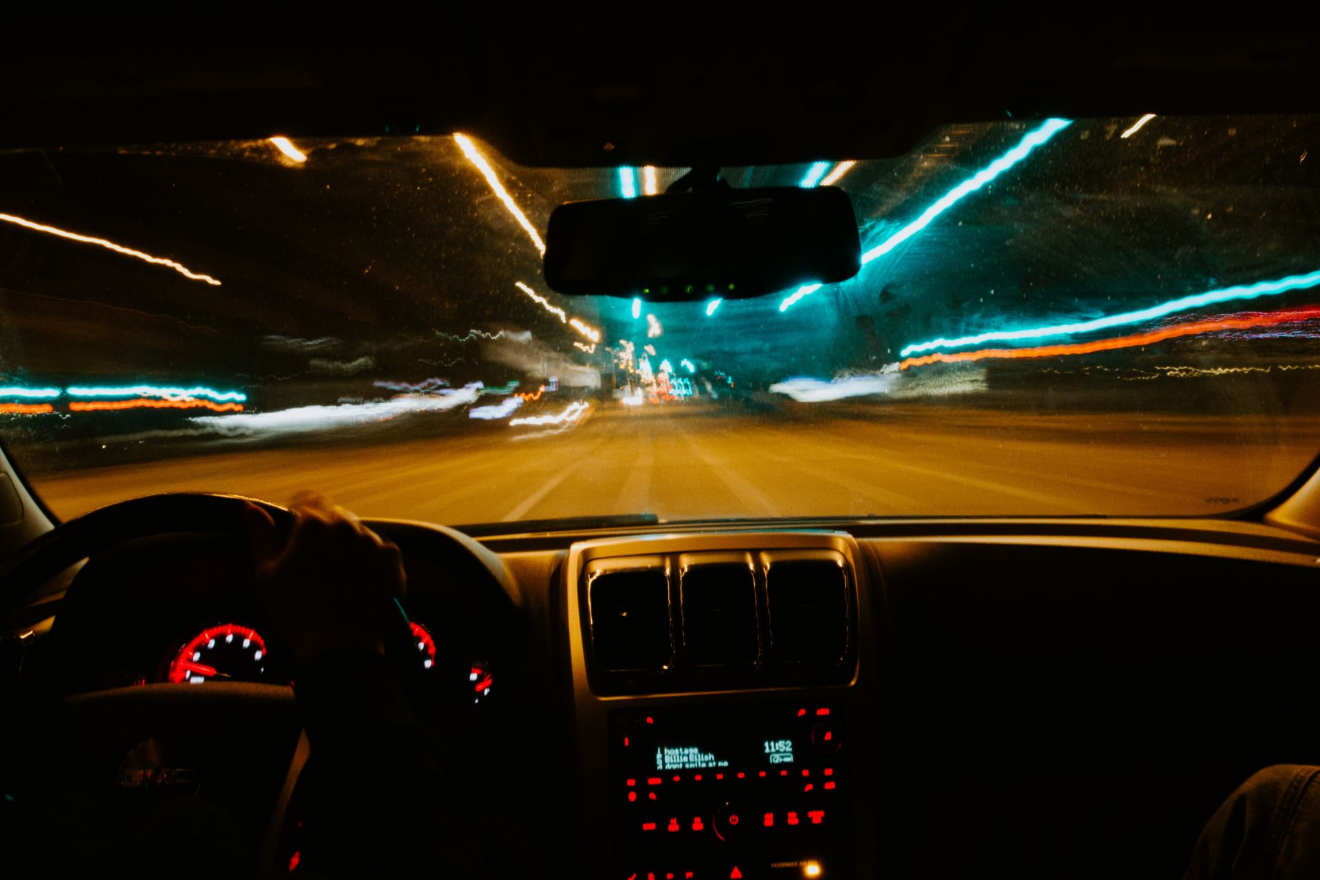 Inside of car driving down the road.