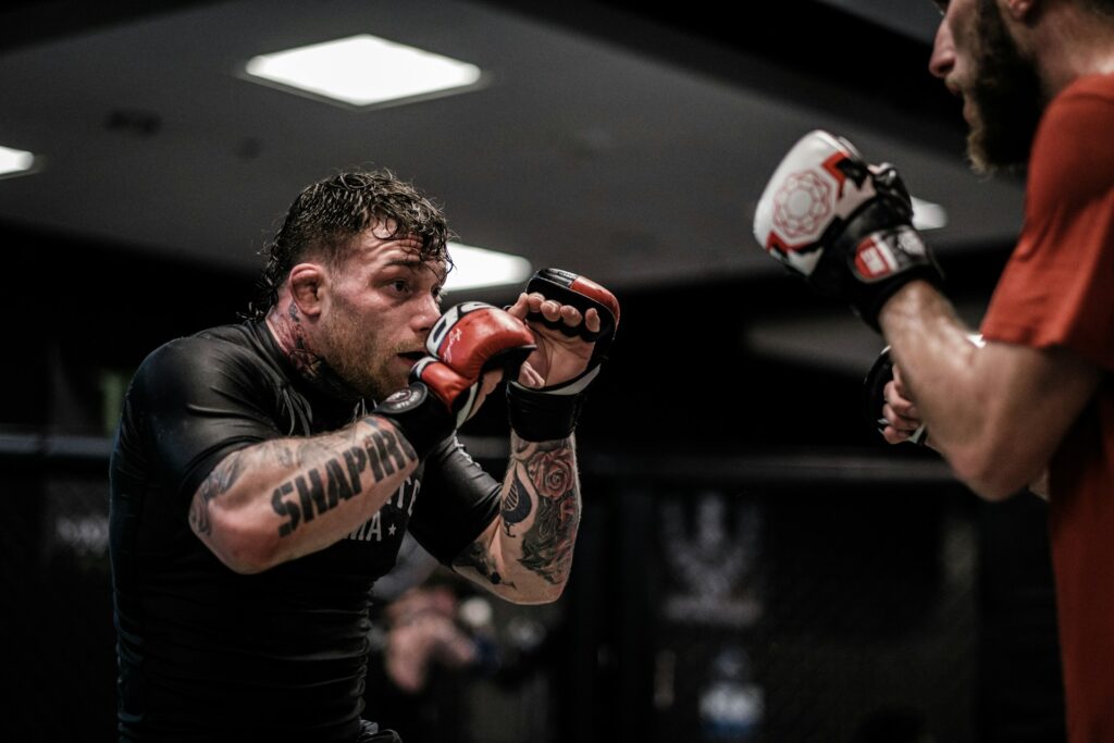 Two men practicing mixed martial arts