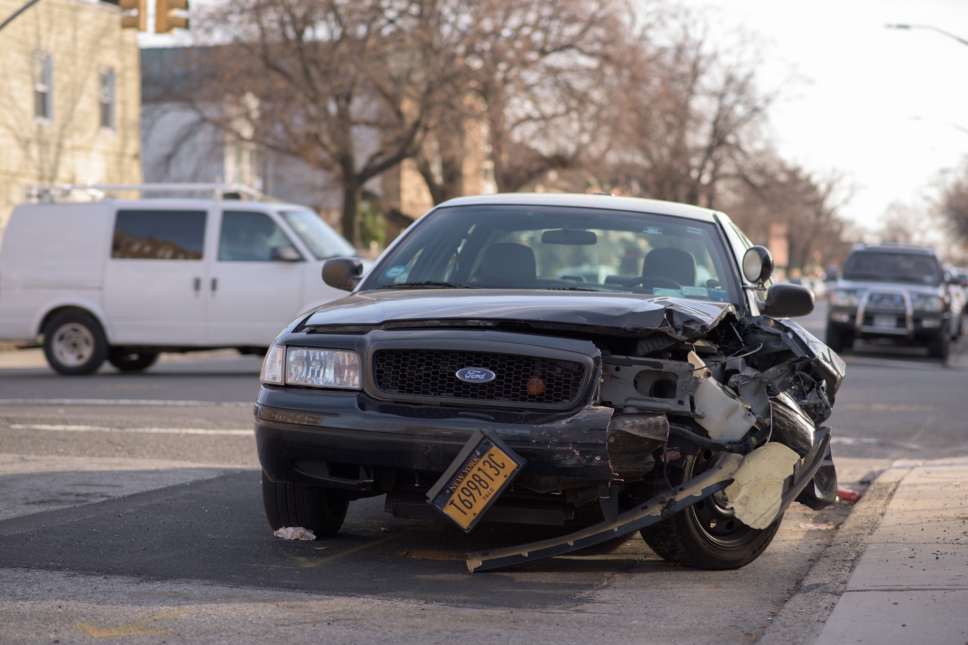 black Ford company car damaged in a crash