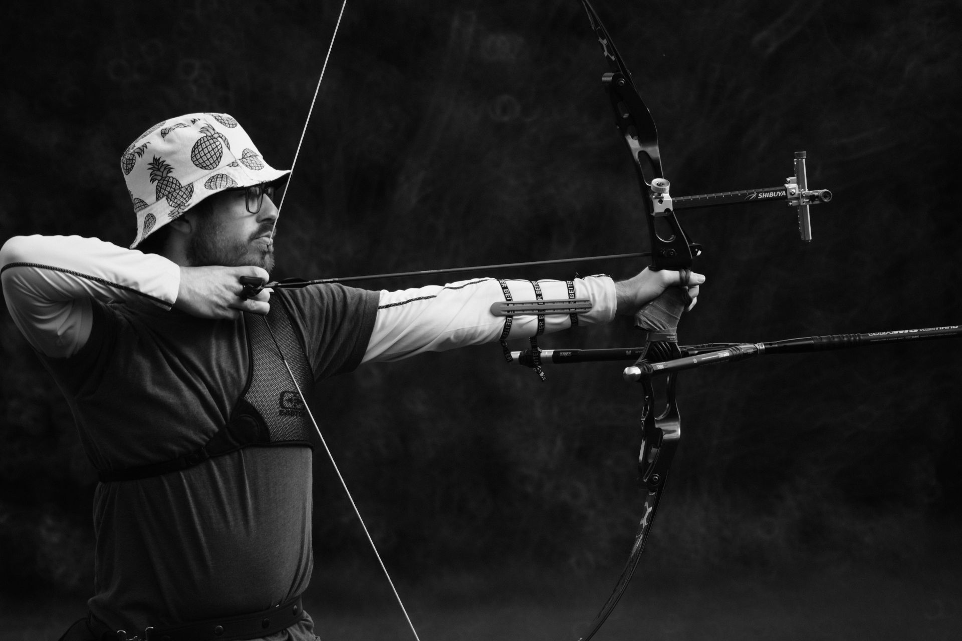 Man pulling back bow.