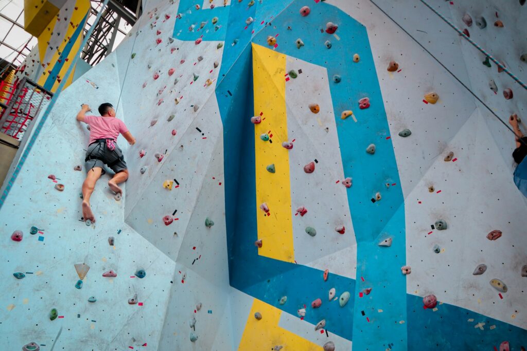 A man in a rock climbing gym