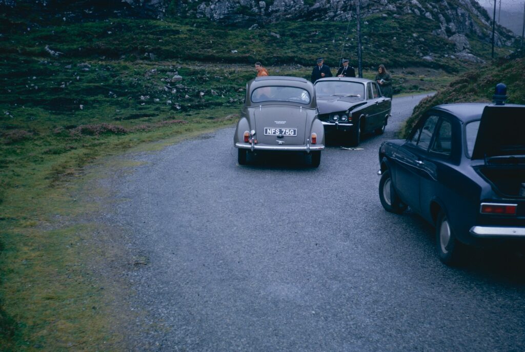 a row of cars pulled over on the side of the road