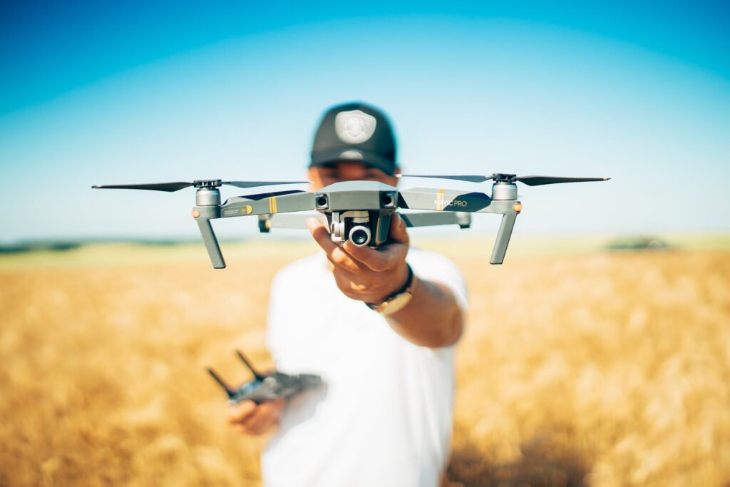 Man holding a drone and controller