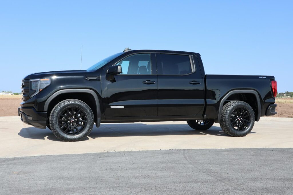 A black GMC Sierra in a parking lot