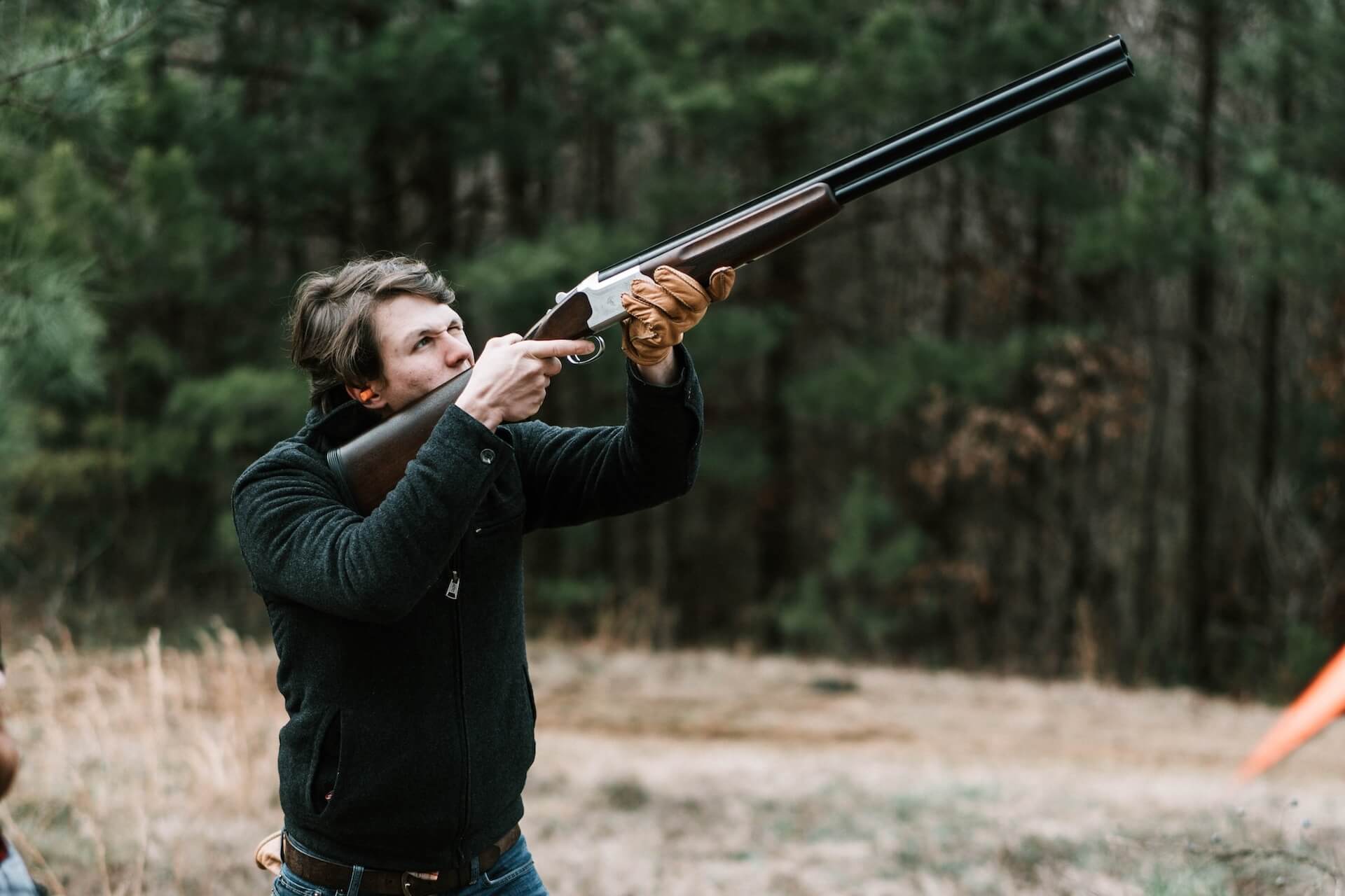 Man doing skeet shooting