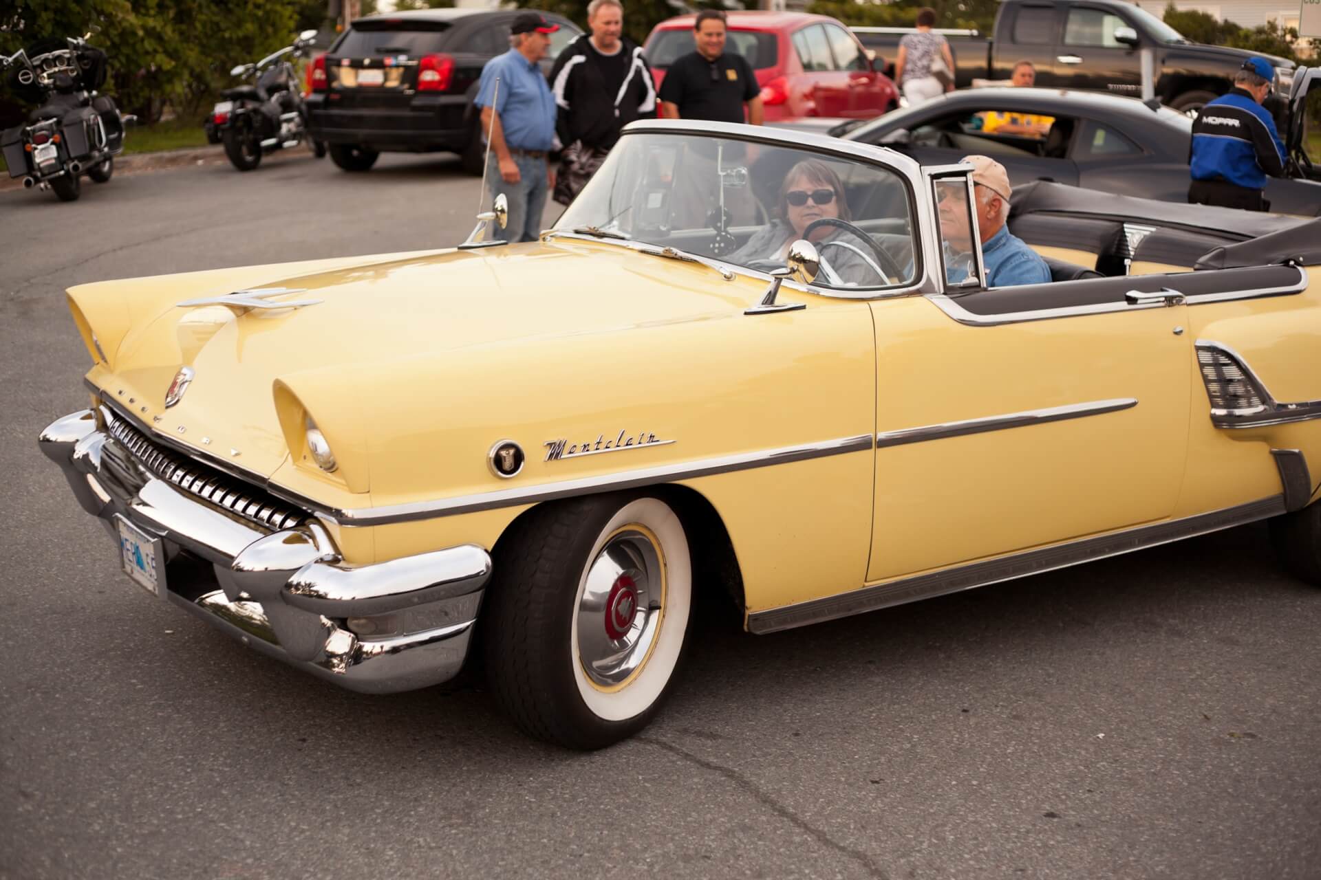 Pale yellow Ford Mercury.