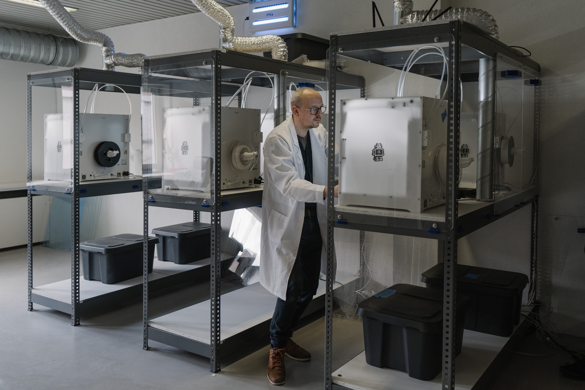 A man in a lab coat in a lab